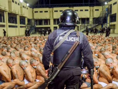Gang members are secured during a police operation at Izalco jail during a 24-hour lockdown ordered by El Salvador's President Nayib Bukele in Izalco, El Salvador, photograph released to Reuters by the El Salvador Presidency on April 25, 2020. El Salvador Presidency/Handout via REUTERS ATTENTION EDITORS - THIS IMAGE HAS BEEN SUPPLIED BY A THIRD PARTY. NO RESALES. NO ARCHIVES. THIS IMAGE WAS PROCESSED BY REUTERS TO ENHANCE QUALITY, AN UNPROCESSED VERSION HAS BEEN PROVIDED SEPARATELY.