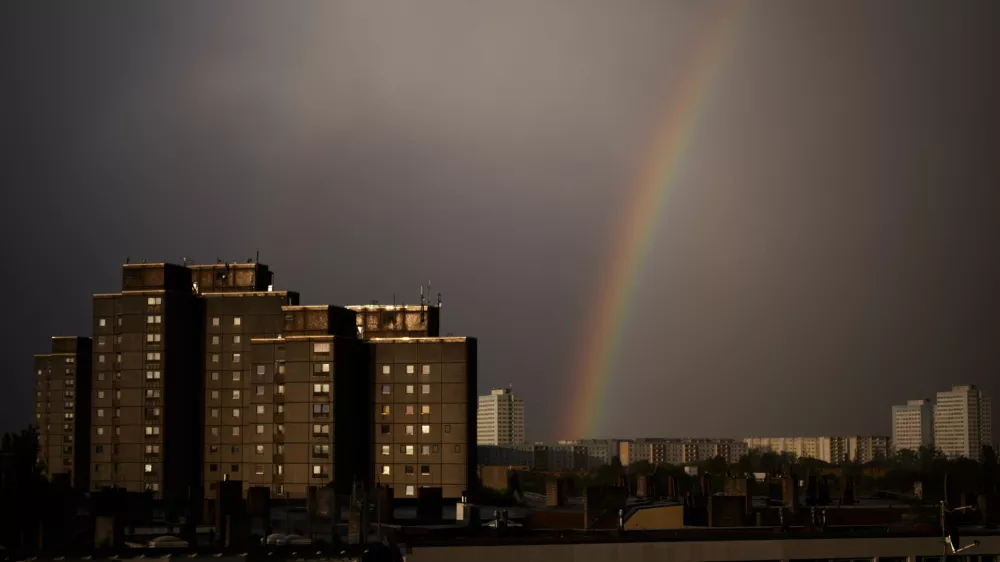 A rainbow appears in the sky over residents buildings in the German capital during a thunderstorm in Berlin, Tuesday, April 16, 2024. (AP Photo/Markus Schreiber)