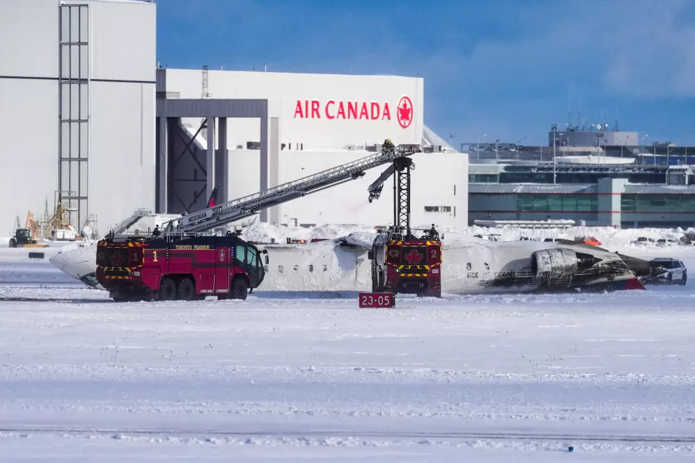 First responders work at the Delta Air Lines plane crash site at Toronto Pearson International Airport in Mississauga, Ontario, Canada February 17, 2025. REUTERS/Arlyn McAdorey