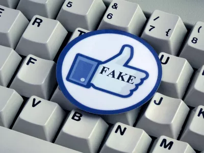 ILLUSTRATION - A "Like" button with the word "FAKE" on it lies on top of a computer keyboard. Taken on 18.12.2016. Facebook is a social network run by the US-American company of the same name, Facebook Inc. Despite serious criticism, Facebook does not want to take on responsibility for deleting so-called "fake news" themselves. Instead they will give a team of external experts the task. "Fake news" refers to false and incorrect information, often spread on purpose via electronic channels (mainly social media). They are deliberately spread by journalists, office-holders, politicians, companies and private individuals. - NO WIRE SERVICE - Photo by: Sascha Steinach/picture-alliance/dpa/AP Images