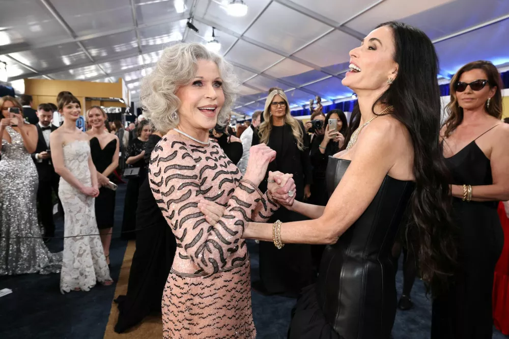 Jane Fonda and Demi Moore react as they attend the 31st Screen Actors Guild Awards, in Los Angeles, California, U.S., February 23, 2025. REUTERS/Mario Anzuoni