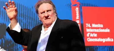FILE PHOTO: Gerard Depardieu waves as he arrives during a red carpet event for the movie "Novecento- Atto Primo" at the 74th Venice Film Festival in Venice, Italy, Italy September 5, 2017.  REUTERS/Alessandro Bianchi/File Photo