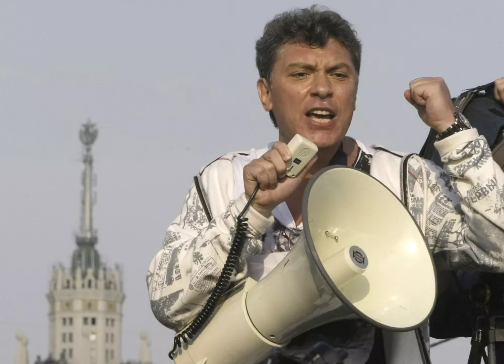 FILE - In this file photo taken on Sunday, May 6, 2012, Opposition leader Boris Nemtsov uses a loud speaker during an opposition rally in downtown Moscow, Russia. Russia's Interior Ministry says Boris Nemtsov, a leading opposition figure and former deputy prime minister, has been shot and killed near the Kremlin. Nemtsov, a sharp critic of President Vladimir Putin, was killed early Saturday. His death comes just a day before a major opposition rally in Moscow. (AP Photo/Misha Japaridze, File)