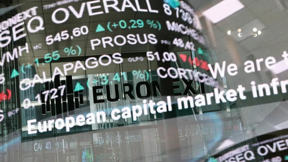 The reflection of a digital board showing trading data at the Euronext stock exchange in the La Defense business district in Paris, France, March 10, 2025. REUTERS/Benoit Tessier