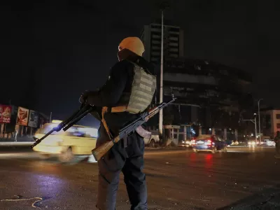 A member of the government security forces stands guard at a street in Damascus, Syria, Thursday, March 6, 2025. (AP Photo/Omar Sanadiki)