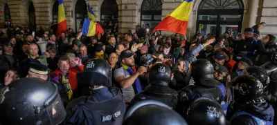FILE PHOTO: Supporters of far-right candidate Calin Georgescu confront riot police outside Romania's central electoral bureau, after the rejection of his candidacy for the May presidential ballot re-run, in Bucharest, Romania, March 9, 2025. Inquam Photos/George Calin via REUTERS ATTENTION EDITORS - THIS IMAGE WAS PROVIDED BY A THIRD PARTY. ROMANIA OUT. NO COMMERCIAL OR EDITORIAL SALES IN ROMANIA/File Photo