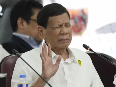 FILE - Former Philippine President Rodrigo Duterte gestures as he answers questions during a joint committee hearing of the House of Representatives investigating the war on drugs during his administration in Quezon City, Philippines on Nov. 13, 2024. (AP Photo/Aaron Favila, File)