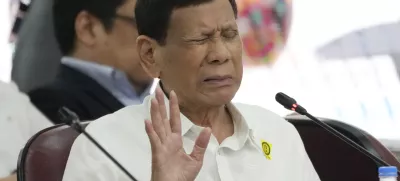 FILE - Former Philippine President Rodrigo Duterte gestures as he answers questions during a joint committee hearing of the House of Representatives investigating the war on drugs during his administration in Quezon City, Philippines on Nov. 13, 2024. (AP Photo/Aaron Favila, File)