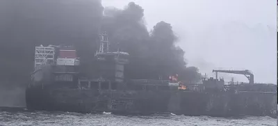 In this image taken from video provided by Denys Mezentsev, rescue crews work on site after a cargo ship was hit by a tanker carrying jet fuel for the U.S. military off eastern England, Monday, March 10, 2025, setting both vessels ablaze and sending fuel pouring into the North Sea. (Denys Mezentsev via AP)