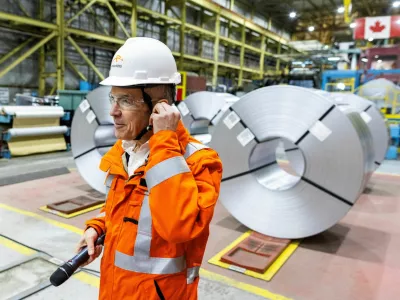 Canada's Prime Minister-designate Mark Carney prepares to speak to workers while he visits the ArcelorMittal Dofasco steel mill in Hamilton, Ontario, Canada March 12, 2025. REUTERS/Carlos Osorio   TPX IMAGES OF THE DAY