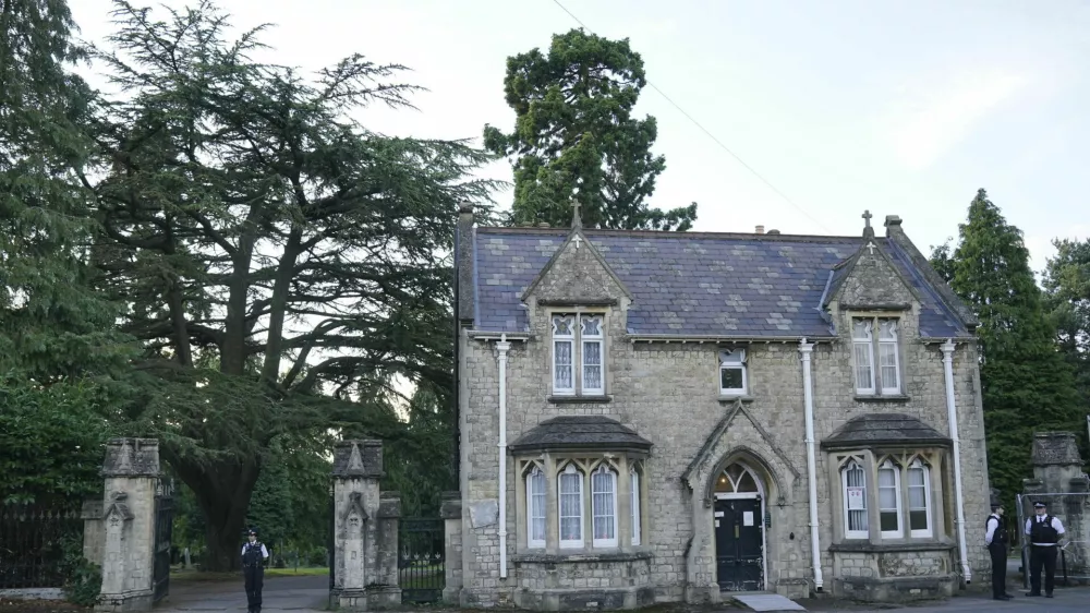 A view of the entrance to Lavender cemetery in Enfield, north London where triple murder suspect Kyle Clifford, 26, was found by officers on Wednesday afternoon, July 10, 2024. British police said they found Wednesday the man suspected of killing the wife and two daughters of a well-known BBC radio commentator near London in a brutal crossbow attack. (Jonathan Brady/PA via AP)