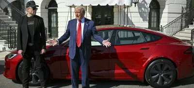 President Donald Trump and Tesla CEO Elon Musk speak to reporters near a red Model S Tesla vehicle on the South Lawn of the White House Tuesday, March 11, 2025, in Washington. (Pool via AP)