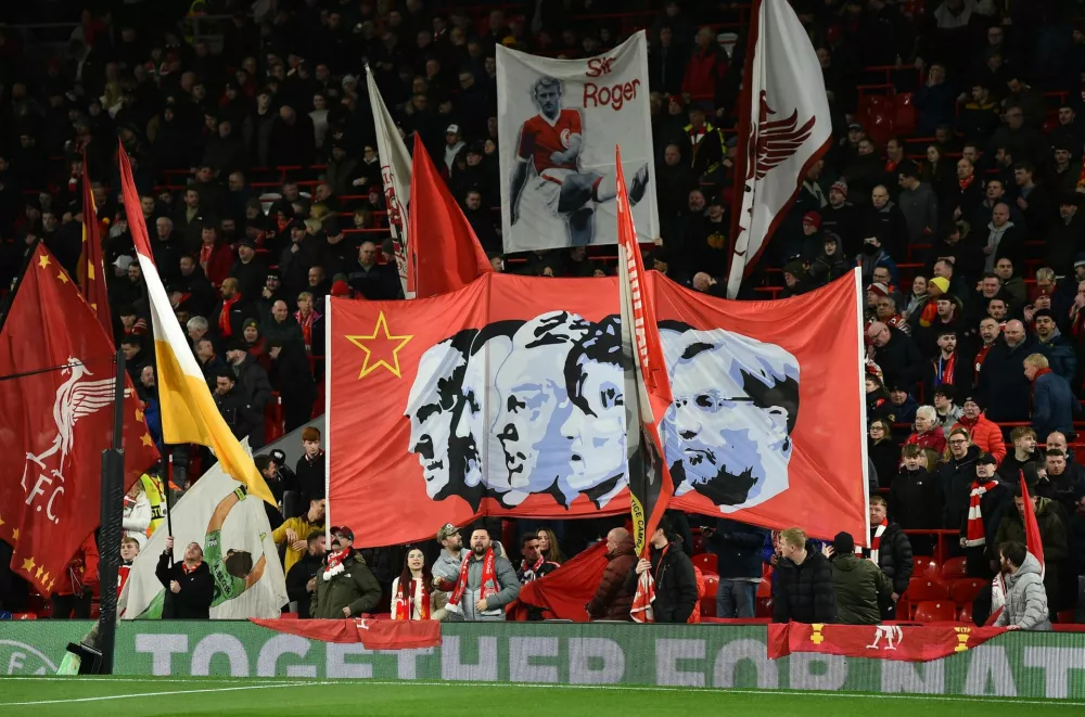 Soccer Football - Champions League - Round of 16 - Second Leg - Liverpool v Paris St Germain - Anfield, Liverpool, Britain - March 11, 2025 Liverpool fans with banners inside the stadium before the match REUTERS/Peter Powell
