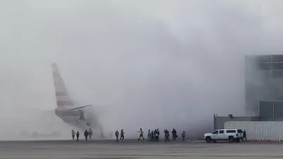 Smoke rises as passengers get evacuated, after an American Airlines jet engine caught fire, in Denver, Colorado, U.S., MARCH 13, 2025, in this screengrab obtained from a social media video. Aaron Clark/via REUTERS THIS IMAGE HAS BEEN SUPPLIED BY A THIRD PARTY. MANDATORY CREDIT. NO RESALES. NO ARCHIVES.