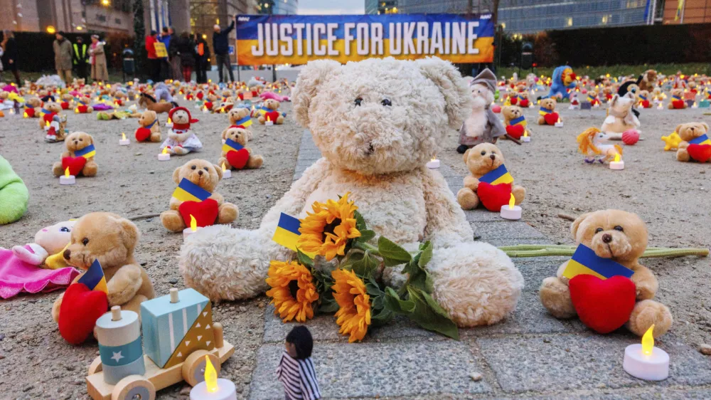 IMAGE DISTRIBUTED FOR AVAAZ.ORG - Avaaz members and Ukrainian refugees install thousands of kids' teddy bears and toys at Schuman Roundabout in front of the European Commission to highlight the reported abduction of thousands of Ukrainian children by Russia on Thursday Feb,23, 2022 in Brussels. Attendants call on EU, US, UK and Canadian leaders to sanction 14 Russian officials who are among those allegedly responsible for the abductions. (Olivier Matthys/AP Images for Avaaz.org)