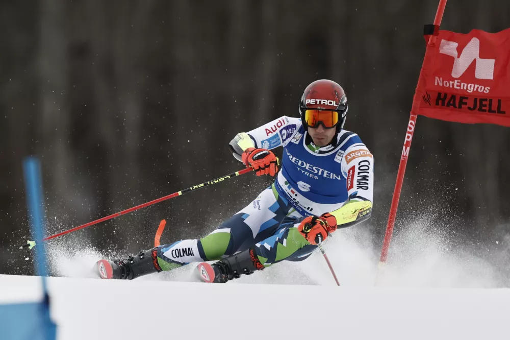 Slovenia's Zan Kranjec competes in an alpine ski, men's World Cup Giant Slalom, in Hafjell, Norway, Saturday, March 15, 2025. (AP Photo/Gabriele Facciotti)