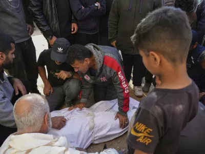 Palestinians mourn over the bodies of their relatives killed by an Israeli airstrike in Beit Lahiya, northern Gaza Strip on Saturday, March 15, 2025. (AP Photo/Jehad Alshrafi)
