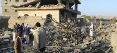 People stand on the rubble of a house hit by a U.S. strike in Saada, Yemen March 16, 2025. REUTERS/Naif Rahma