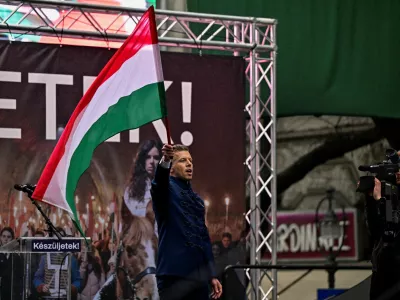 Peter Magyar, leader of Hungarian opposition TISZA party, waves a national flag at the demonstration, during Hungary's National Day celebrations, which also commemorate the 1848 Hungarian Revolution against the Habsburg monarchy, in Budapest, Hungary, March 15, 2025. REUTERS/Marton Monus