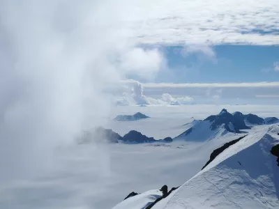 In this 2011 photo provided by researcher Hamish Pritchard, summer clouds swirl around the Staccato Peaks of Alexander Island off the Antarctic Peninsula. In a study released Wednesday, June 13, 2018, an international team of ice experts said the melting of Antarctica is accelerating at an alarming rate, with about 3 trillion tons of ice disappearing since 1992.&Acirc;&nbsp;&acirc;&euro;&uml;(Hamish Pritchard/British Antarctic Survey via AP)