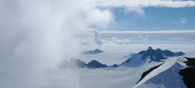 In this 2011 photo provided by researcher Hamish Pritchard, summer clouds swirl around the Staccato Peaks of Alexander Island off the Antarctic Peninsula. In a study released Wednesday, June 13, 2018, an international team of ice experts said the melting of Antarctica is accelerating at an alarming rate, with about 3 trillion tons of ice disappearing since 1992.Â â€¨(Hamish Pritchard/British Antarctic Survey via AP)