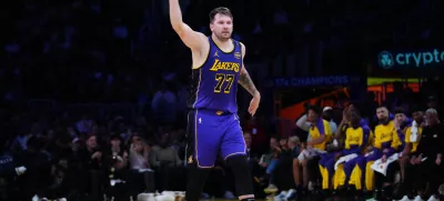 Mar 17, 2025; Los Angeles, California, USA; Los Angeles Lakers guard Luka Doncic (77) reacts against the San Antonio Spurs in the first half at Crypto.com Arena. Mandatory Credit: Kirby Lee-Imagn Images