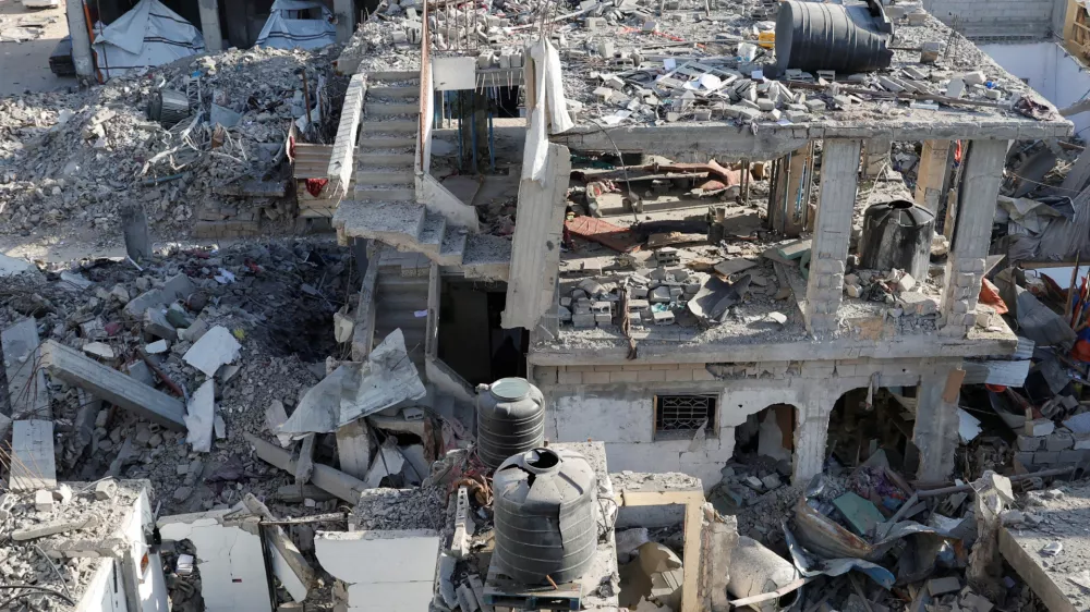 A general view of the site of an Israeli strike on a house, in Khan Younis in the southern Gaza Strip March 18, 2025. REUTERS/Hatem Khaled