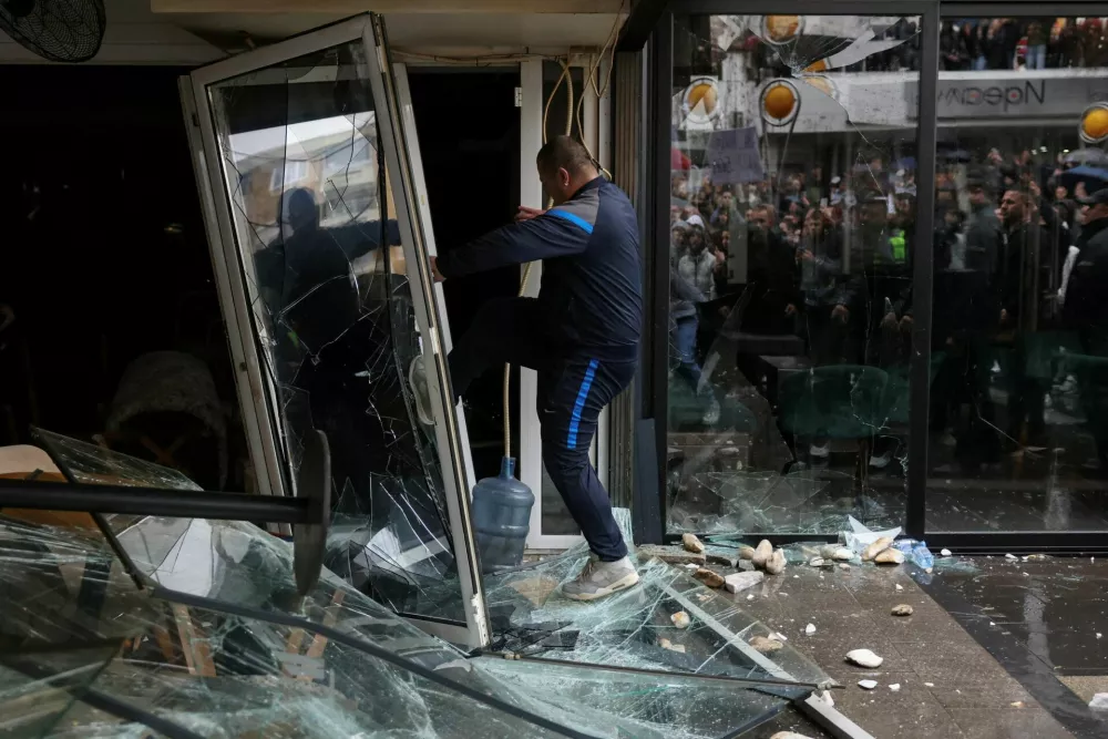 People smash a pub, which according to protesters belongs to the owner of Pulse nightclub, following a fire in the club that resulted in dozens of deaths, in the town of Kocani, North Macedonia, March 17, 2025. REUTERS/Alexandros Avramidis   TPX IMAGES OF THE DAY