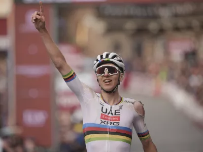 Tadej Pogačar riding for the UAE Team Emirates celebrates winning 19th edition of the Strade Bianche (White Roads) a 213 km one day race from Siena, Italy, Saturday March 8, 2025. (Marco AlpozziLaPresse via AP)