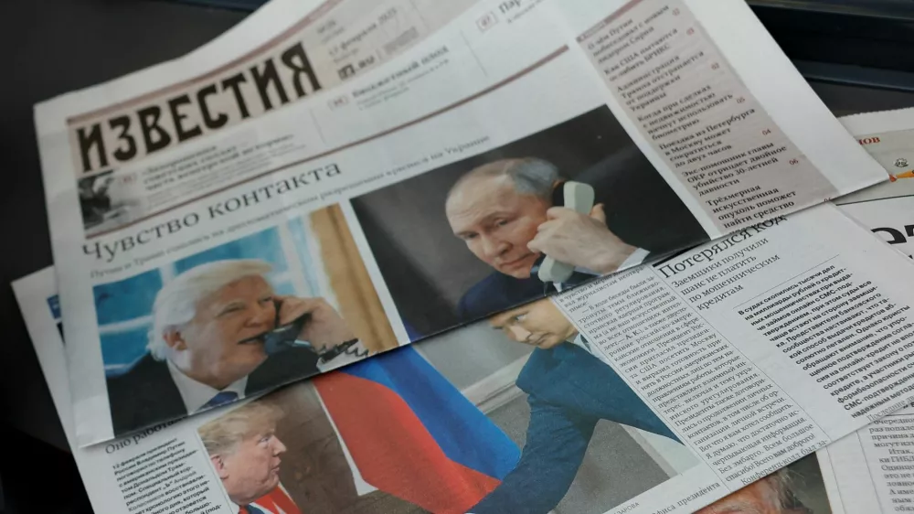 Daily newspapers with covers, dedicated to the recent phone call of Russian President Vladimir Putin and U.S. President Donald Trump, are laid out at a newsstand in a street in Moscow, Russia, February 13, 2025. REUTERS/Maxim Shemetov/Illustration