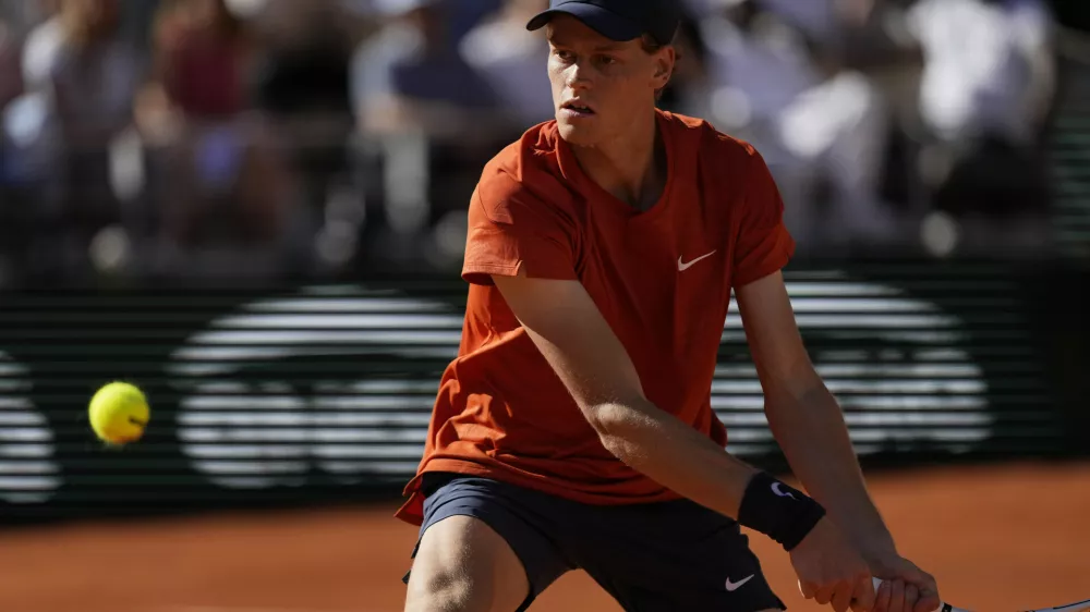 FILE - Italy's Jannik Sinner plays a shot against Spain's Carlos Alcaraz during their semifinal match of the French Open tennis tournament at the Roland Garros stadium in Paris, Friday, June 7, 2024. (AP Photo/Thibault Camus, File)