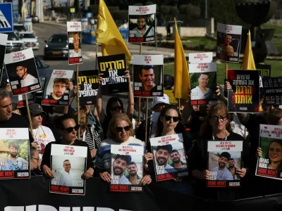 Family members and supporters of hostages stand outside the Knesset, the Israeli parliament, during a statement to the press demanding the return of all hostages kidnapped during the deadly October 7, 2023 attack by Hamas, in Jerusalem, March 18, 2025. REUTERS/Ronen Zvulun