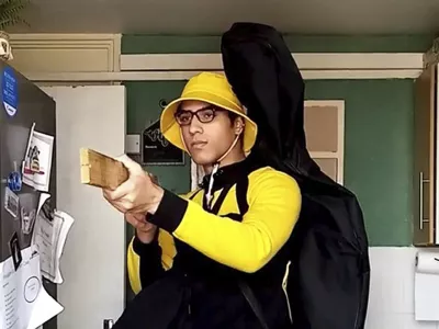 Undated handout screengrab issued by Bedfordshire Police of of teenager Nicholas Prosper holding a plank of wood as a mock gun, pretending to shoot people. (Bedfordshire Police/PA via AP)
