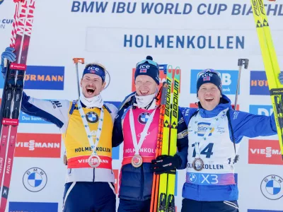 21 March 2025, Norway, Oslo: Oslo 20250321. (L-R) Norway's second placed Sturla Holm Laegreid, winner Johannes Thingnes Boe and third placed Johannes Dale-Skjevdal celebrate on the podium after the men's 10 km in the Biathlon World Cup in Holmenkollen. Photo: Javad Parsa/NTB/dpa