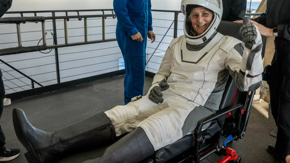 NASA astronaut Suni Williams is helped out of a SpaceX Dragon spacecraft onboard the SpaceX recovery ship MEGAN after she, NASA astronaut Nick Hague, and Butch Wilmore, and Roscosmos cosmonaut Aleksandr Gorbunov landed in the water off the coast of Tallahassee, Florida, Tuesday, March 18, 2025. NASA/Keegan Barber/ Handout via REUTERS