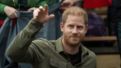 FILE - Prince Harry, the Duke of Sussex, cheers with Team Lithuania during Sitting Volleyball at the 2025 Invictus Games, in Vancouver, on Saturday, Feb. 15, 2025. (Ethan Cairns/The Canadian Press via AP, file)
