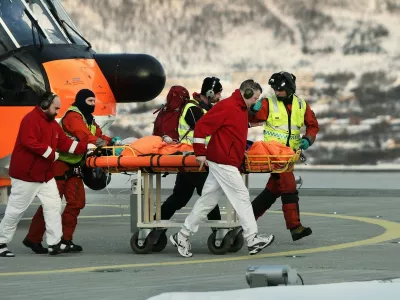 Rescue workers bring a survivor from the helicopter to the hospital in Tromso after six skiers were taken by an avalanche near Kaafjord in northern Norway on March 19, 2012. According to initial information to police, six people from a 12-member expedition apparently made up of French nationals were taken by an avalanche at around 2:30 pm (1330 GMT), at an altitude of about 1,000 metres (3,280 feet) on the Sorbmegaisa mountain in the Kaafjord municipality.,Image: 121810320, License: Rights-managed, Restrictions: NORWAY OUT, Model Release: noFoto: Profimedia