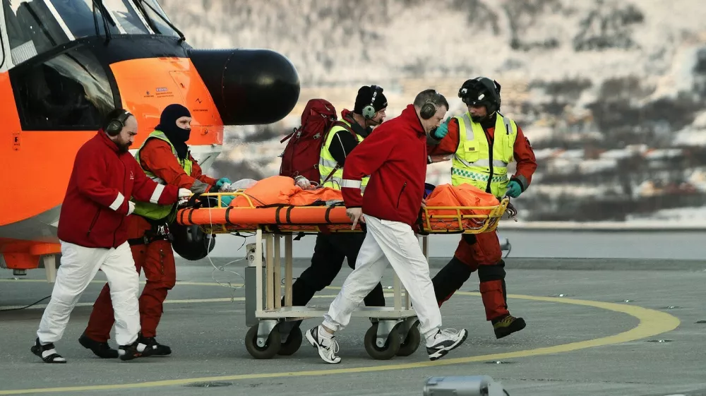 Rescue workers bring a survivor from the helicopter to the hospital in Tromso after six skiers were taken by an avalanche near Kaafjord in northern Norway on March 19, 2012. According to initial information to police, six people from a 12-member expedition apparently made up of French nationals were taken by an avalanche at around 2:30 pm (1330 GMT), at an altitude of about 1,000 metres (3,280 feet) on the Sorbmegaisa mountain in the Kaafjord municipality.,Image: 121810320, License: Rights-managed, Restrictions: NORWAY OUT, Model Release: noFoto: Profimedia