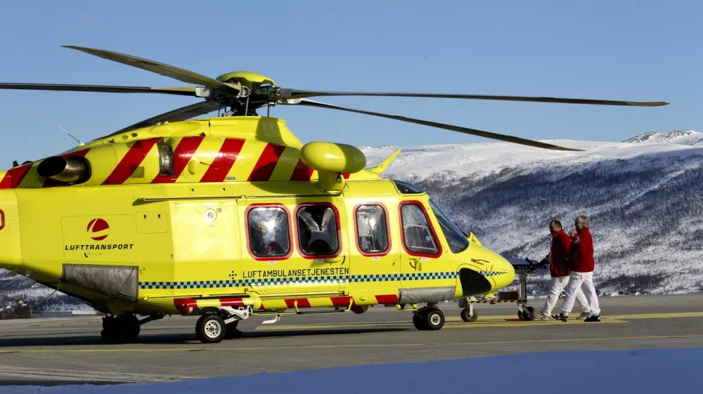 This picture shows a helicopter at the landing area of the University Hospital in Tromsoe, where the injured person during an avalanche was taken, and where the five bodies are being kept, on March 20, 2012 in Tromso. Five people died after an avalanche hit an expedition of Swiss nationals led by a French guide on a mountain in northern Norway. AFP PHOTO DANIEL SANNUM LAUTEN,Image: 121844547, License: Rights-managed, Restrictions:, Model Release: noFoto: Profimedia