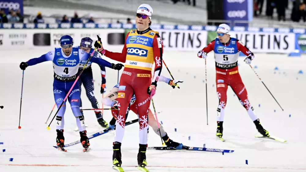 Winner Johannes Hoesflot Klaebo of Norway, Frederico Pellegrino of Italy, left, and Erik Valnes of Norway, right, compete during the men's cross-country skiing freestyle sprint final at the FIS Nordic World Cup Lahti Ski Games in Lahti, Finland, Friday, March 21, 2025. (Emmi Korhonen/Lehtikuva via AP)