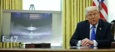 U.S. President Donald Trump delivers remarks, as an image of an F47 is displayed near him, in the Oval Office at the White House, in Washington, D.C., U.S., March 21, 2025. REUTERS/Carlos Barria