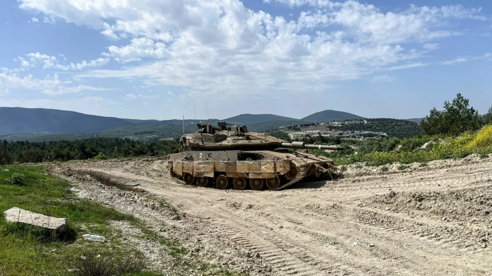 FILE PHOTO: An Israeli tank is positioned on the Israeli side of the Israel-Lebanon border, March 18, 2025 REUTERS/Avi Ohayon/File Photo