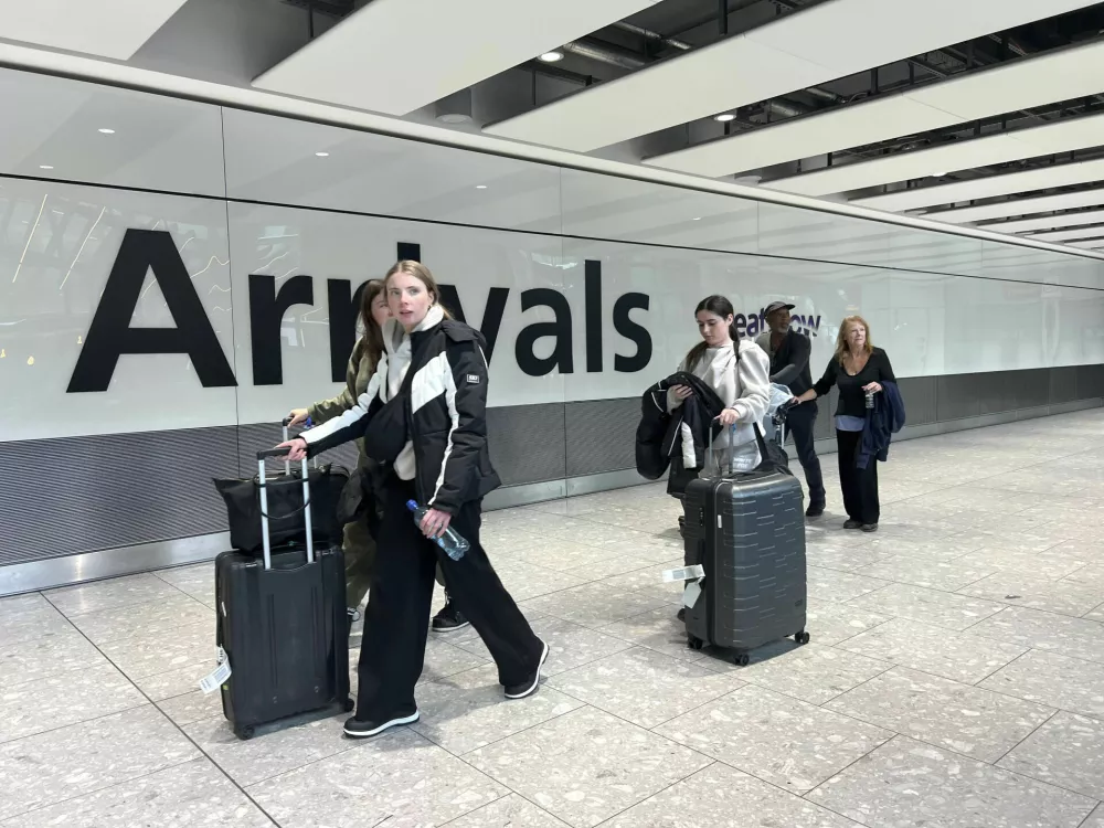 Passengers in the arrivals hall at Heathrow Terminal 5 in London, Saturday March 22, 2025, after flights resumed at the airport. (Maja Smiejkowska/PA via AP)