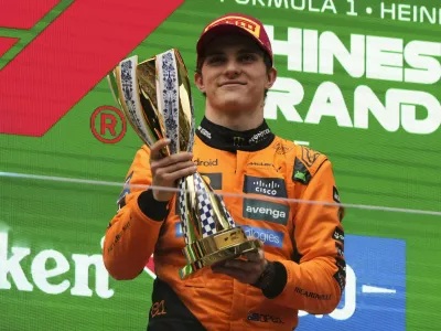 McLaren driver Oscar Piastri of Australia celebrates on the podium after winning the Chinese Formula One Grand Prix race at the Shanghai International Circuit, Shanghai, Sunday, March 23, 2025. (AP Photo/Andy Wong)