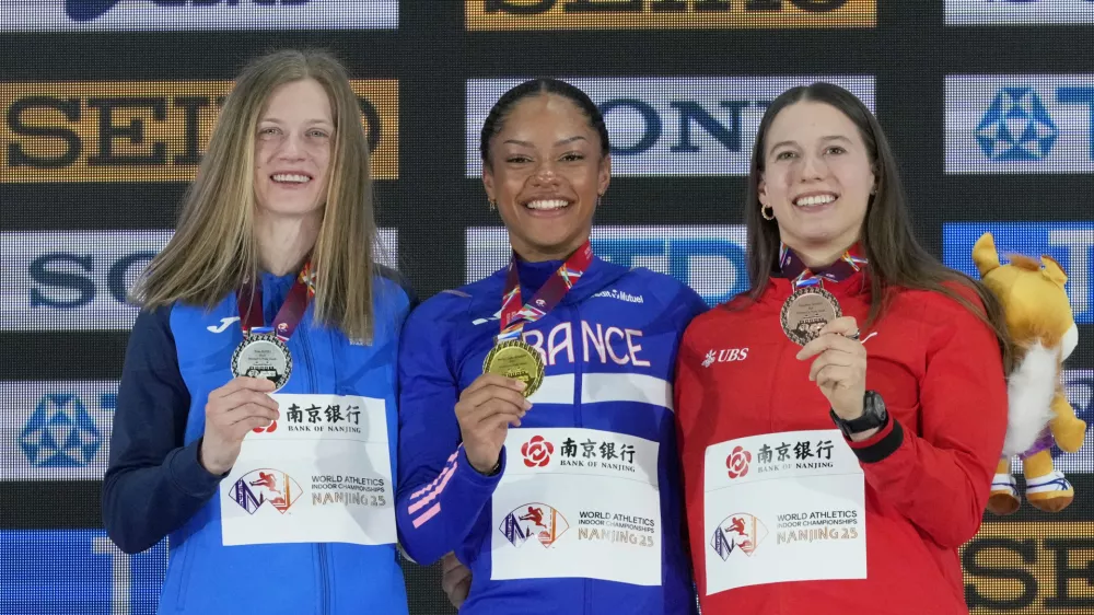 Silver medalist Tina Sutej, of Slovenia, gold medalist Marie-Julie Bonnin, of France, and bronze medalist Angelica Moser, of Switzerland, from left, pose on the podium of the women's pole vault at the World Athletics Indoor Championships in Nanjing, China, Saturday, March 22, 2025. (AP Photo/Dar Yasin)