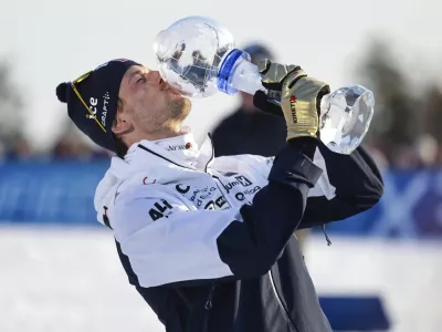 Sturla Holm L&aelig;greid of Norway wins the overall World Cup after the biathlon men's 15 km mass start at the World Cup in Holmenkollen, Norway, Sunday, March 23, 2025. (Thomas Andersen/NTB Scanpix via AP)