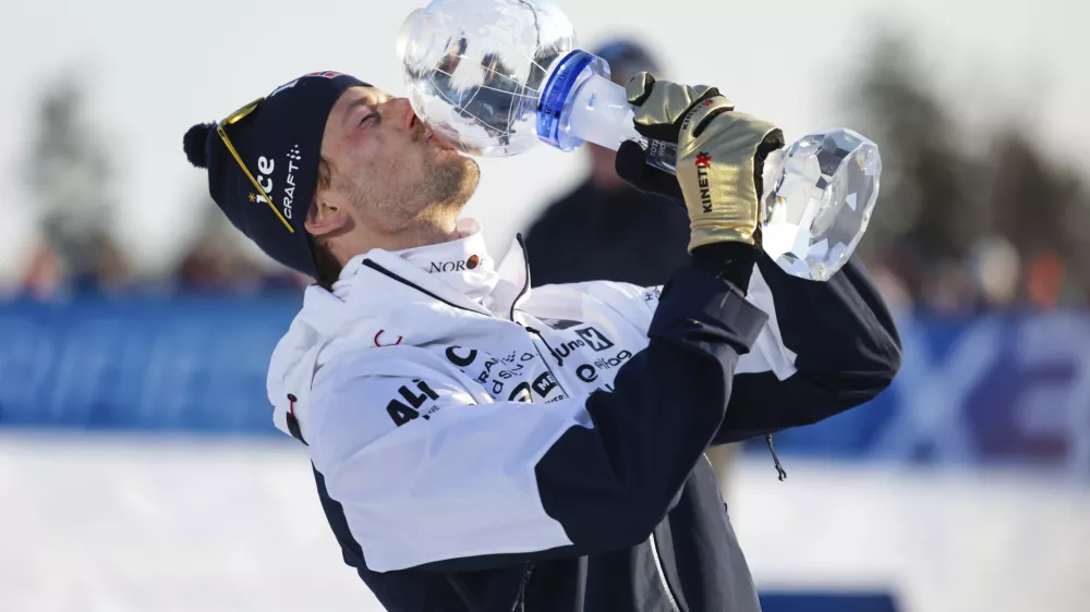Sturla Holm L&aelig;greid of Norway wins the overall World Cup after the biathlon men's 15 km mass start at the World Cup in Holmenkollen, Norway, Sunday, March 23, 2025. (Thomas Andersen/NTB Scanpix via AP)
