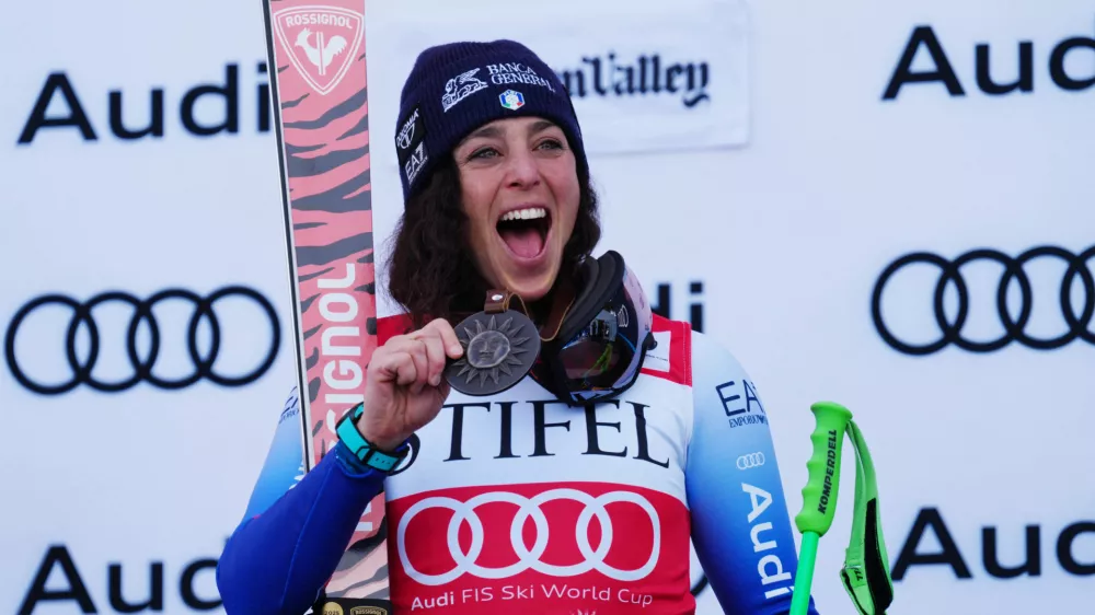 Mar 23, 2025; Sun Valley, ID, USA; Federica Brignone of Italy celebrates on the podium after the Super G alpine skiing race in the 2025 FIS Ski World Cup at Sun Valley. Mandatory Credit: Christopher Creveling-Imagn Images