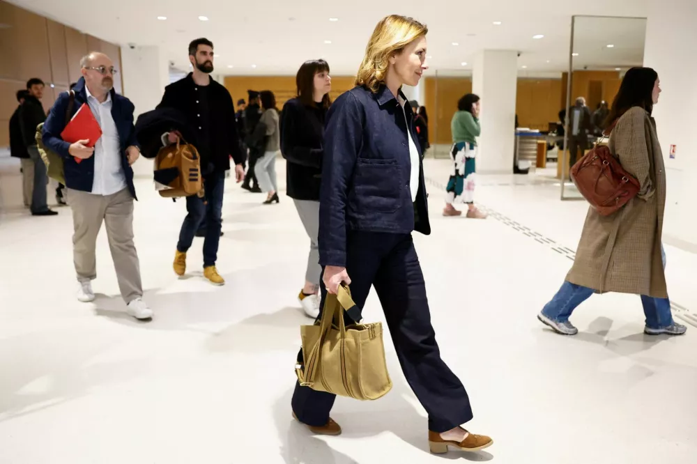 Plaintiff Amelie K walks, on the day of the trial of French actor Gerard Depardieu for two sexual assaults allegedly committed on the set of the film "Les Volets Verts", at the courthouse in Paris, France, March 24, 2025. REUTERS/Abdul Saboor