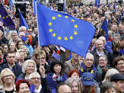 Supporters wave a European flags attending a rally of the Pulse of Europe movement in Frankfurt, Germany, Sunday, March 19, 2017. Pulse of Europe goes to the streets equipped with the symbols of Europe, flags and Ode to Joy. The protesters take a stand for Europe in public for everyone to see. (AP Photo/Michael Probst)